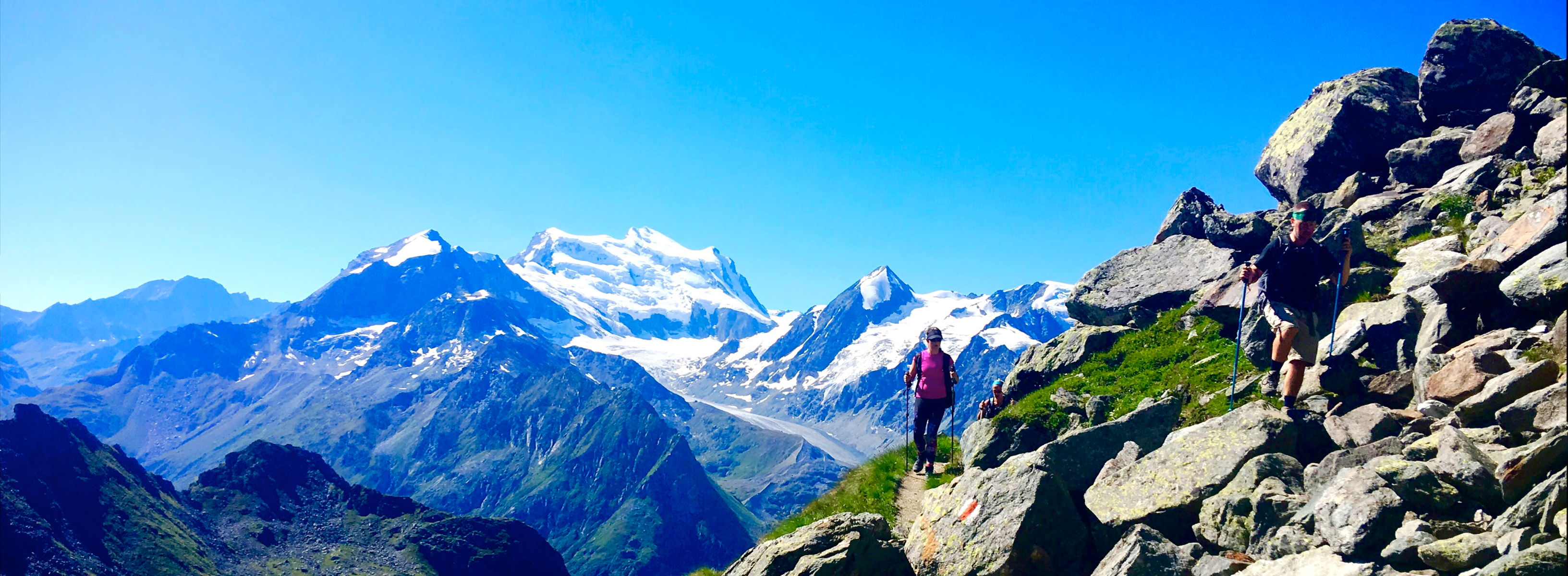 Hikers on the high route between Chamonix and Zermatt Hikers on the high route between Chamonix and Zermatt