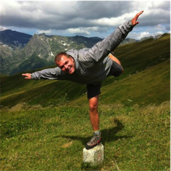 Mark balancing on the border stone between France and Switzerland