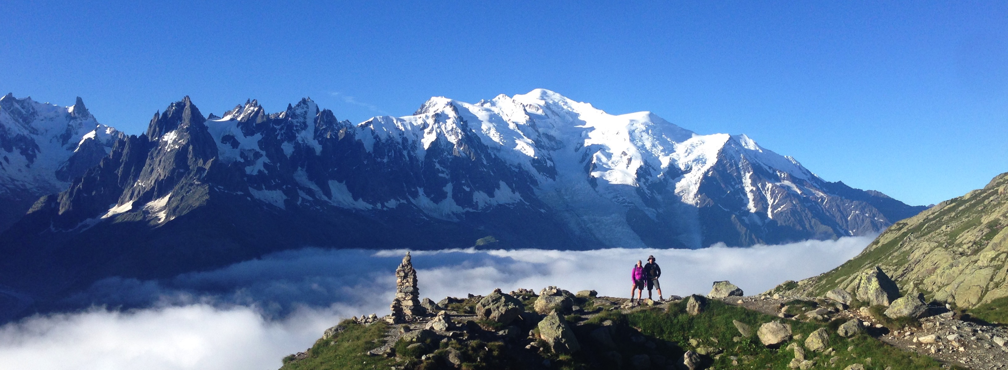 Hikers on our guided TMB tour in front of Mont Blanc